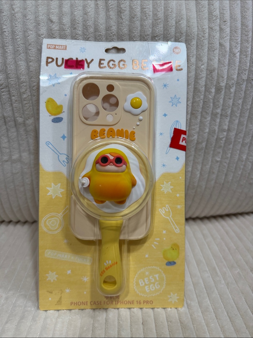 Pucky Egg Beanie Yellow Egg Phone Case with Handle for iPhone 16 Pro